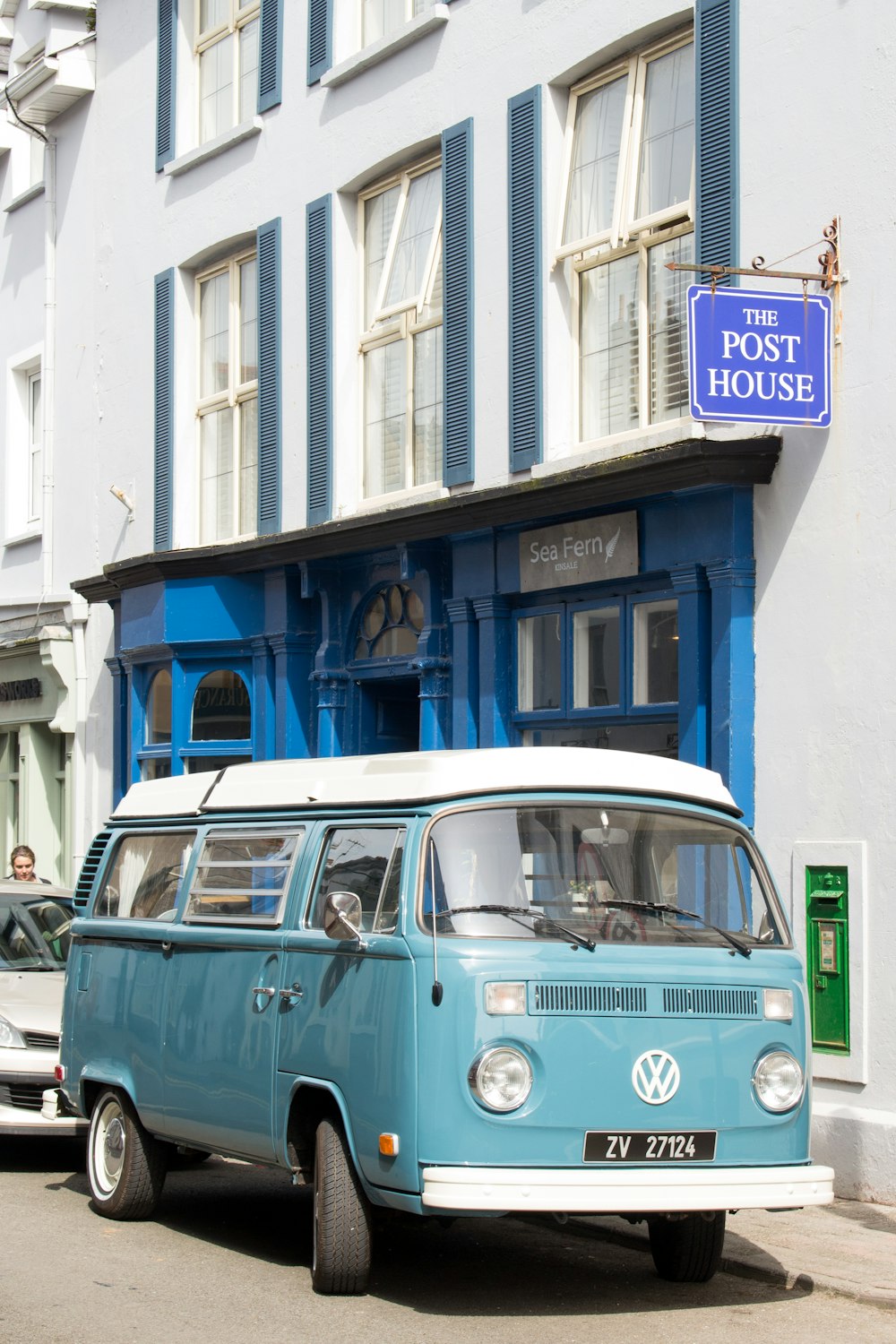 blue and white Volkswagen van besides The Post House