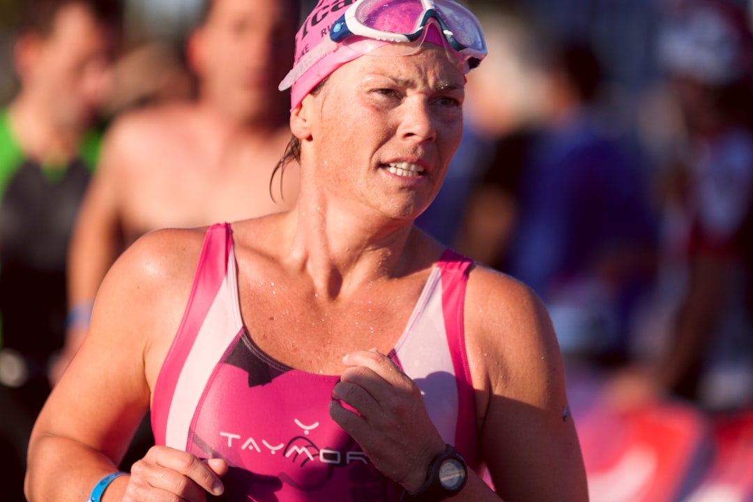 woman wearing pink and white tank top and goggles