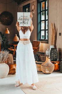 woman holding white labeled box