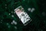 white Android smartphone near green plant