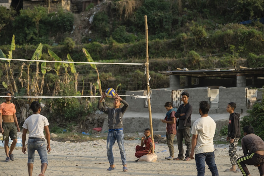 group of men playing volleyball