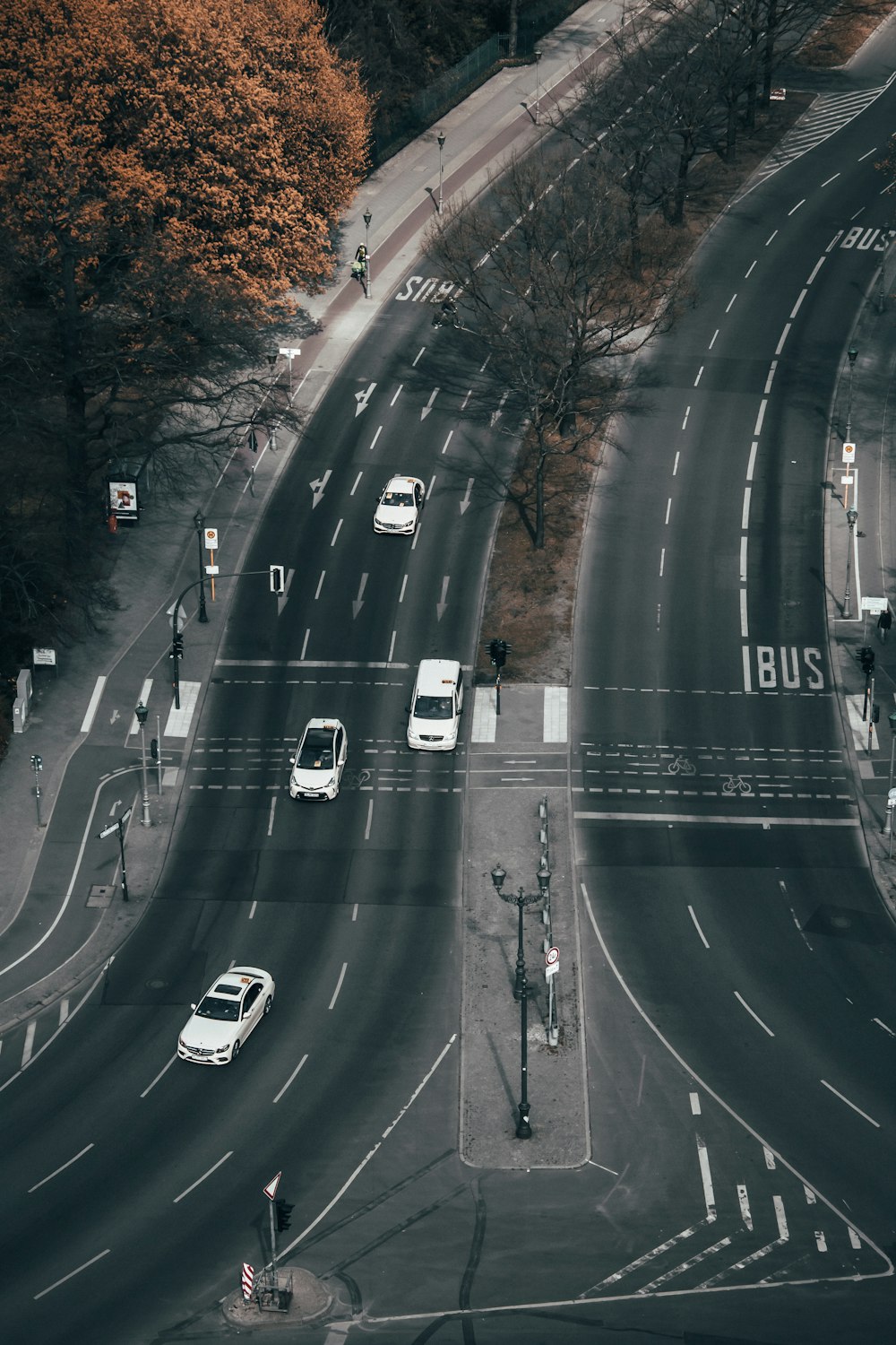 white cars passing by road