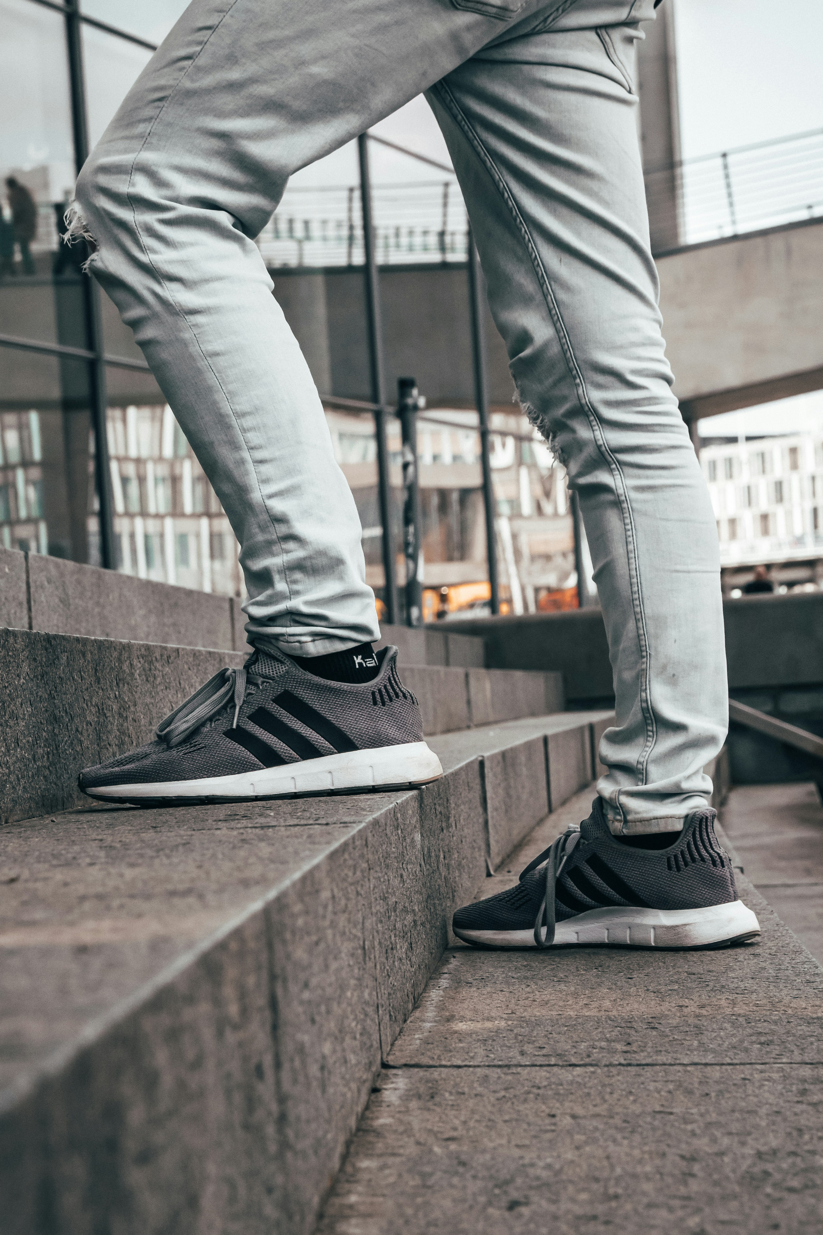 grey jeans and black shoes
