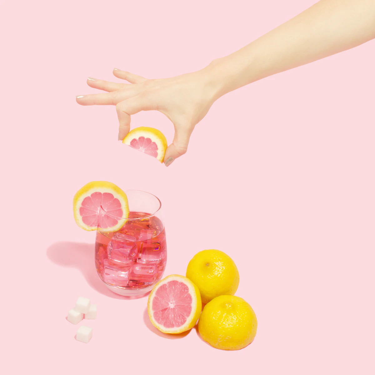 Bartender adding fresh citrus garnish to a hand-crafted cocktail