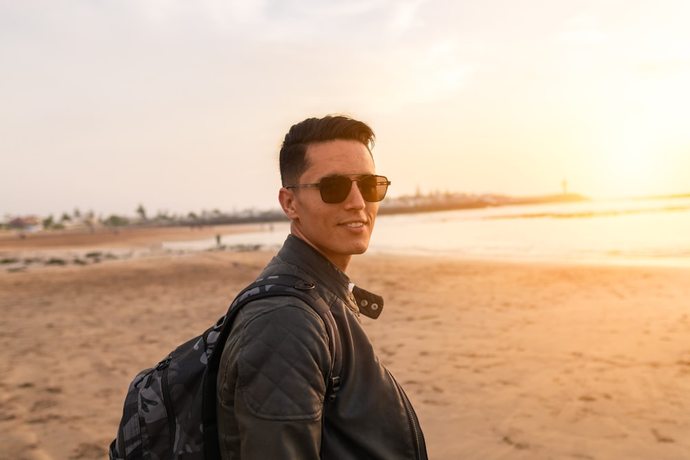 smiling man standing near seashore