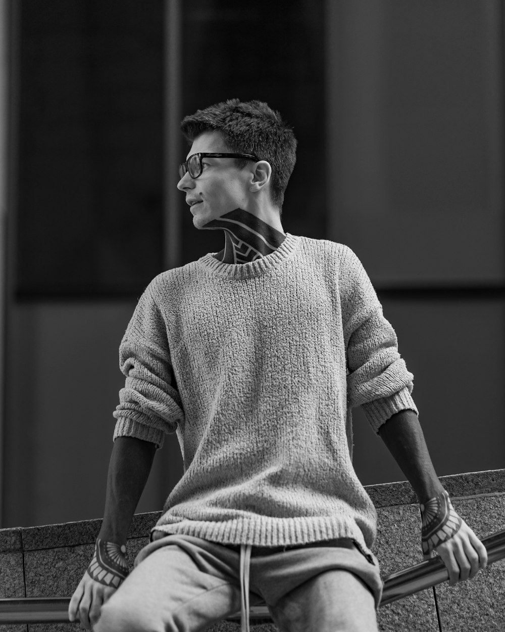 grayscale photo of man in sweater