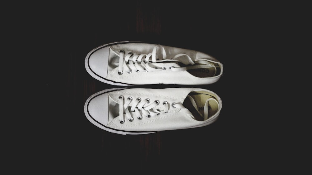 pair of white Converse low-top sneakers