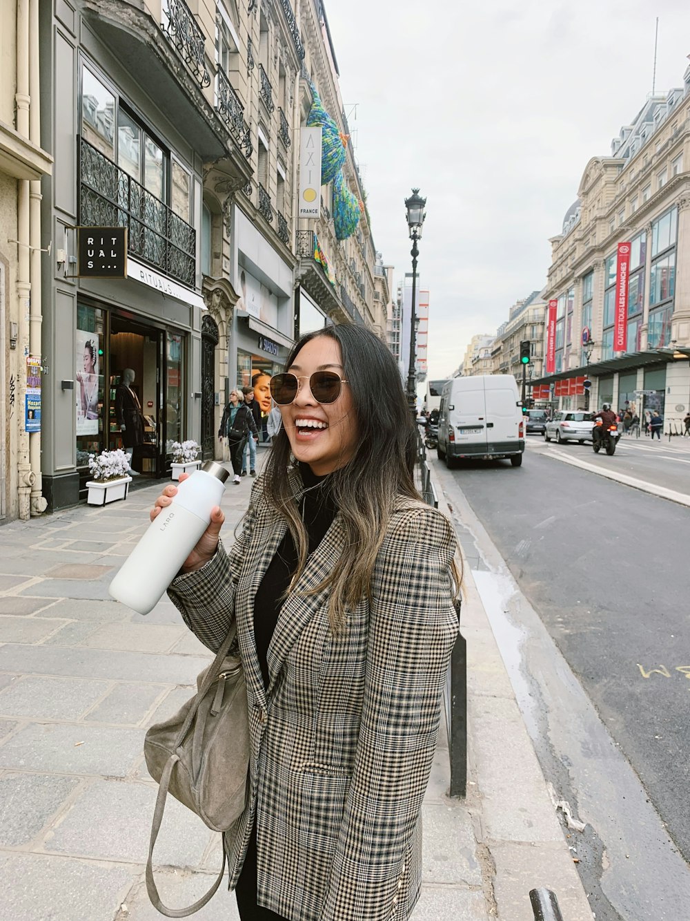 woman smiling near road