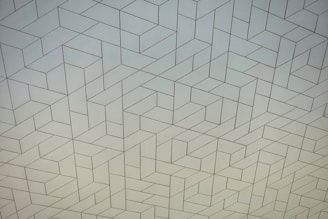 a white wall with a pattern on it