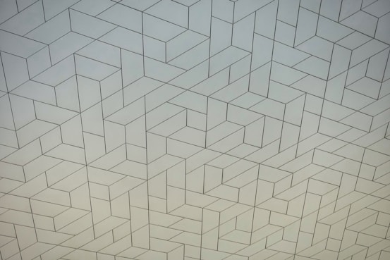 a white wall with a pattern on it