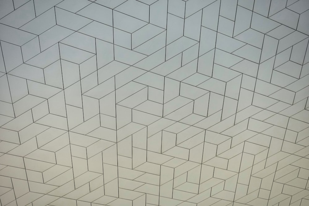 a white wall with a pattern on it