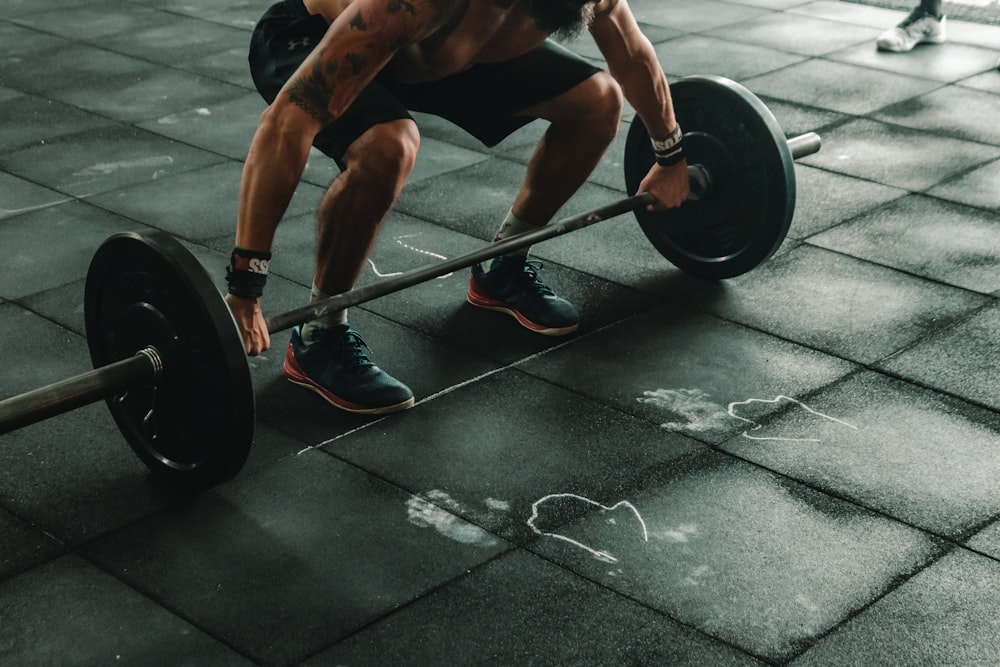 man holding dumbbells