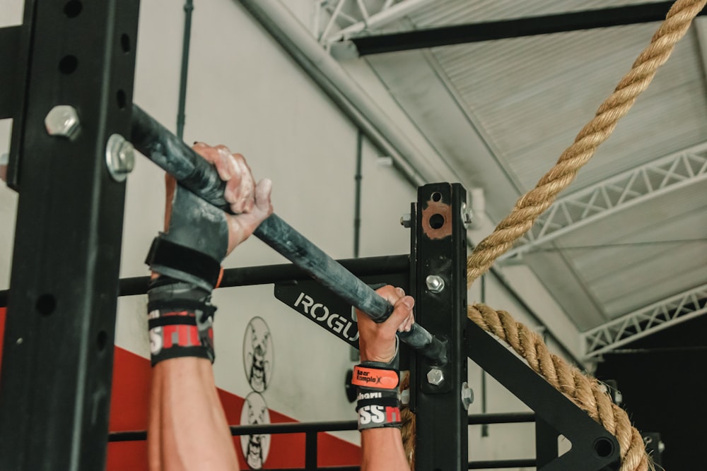 person holding barbell