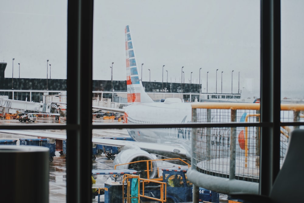 white and orange airplane during daytime