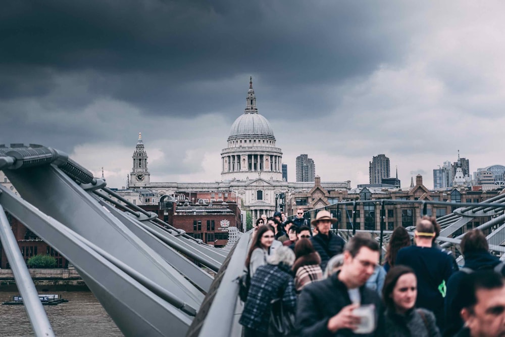 people walking steel bridge