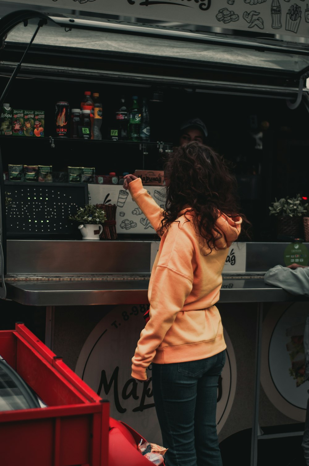 person standing near food stall