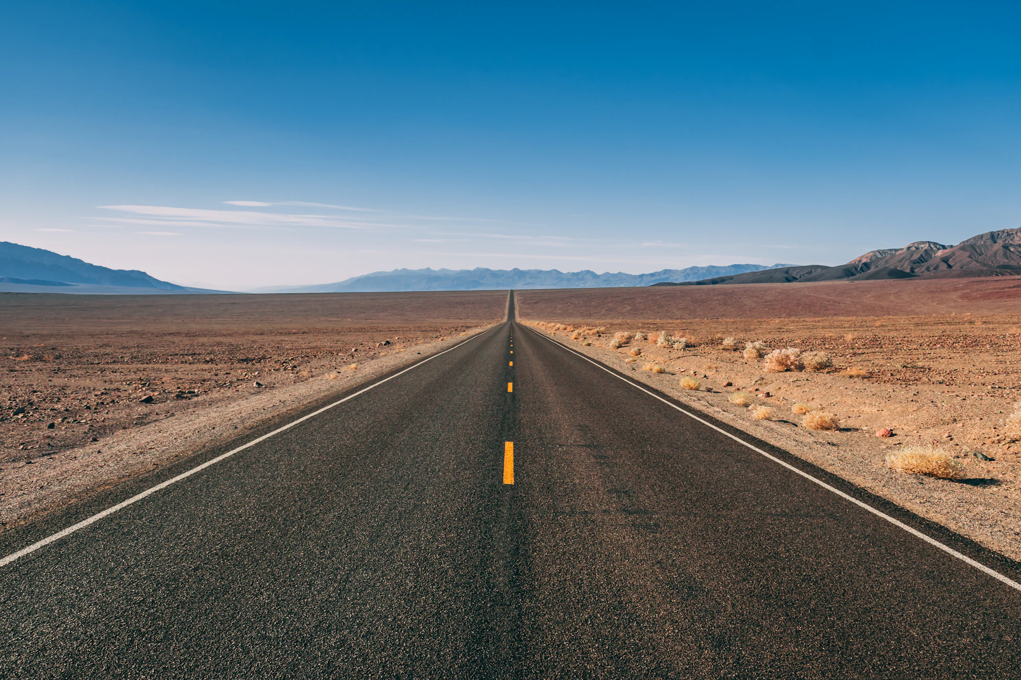 Highway stretching to the horizon at golden hour