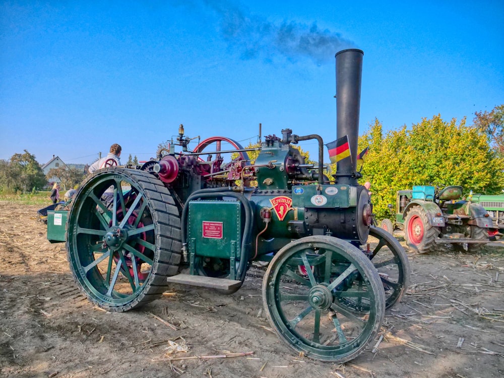 green tractor under blue sky