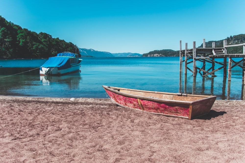 red and brown wooden boat