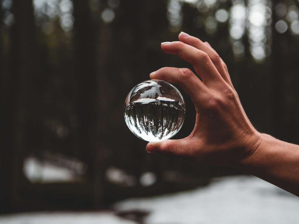 man holding glass container