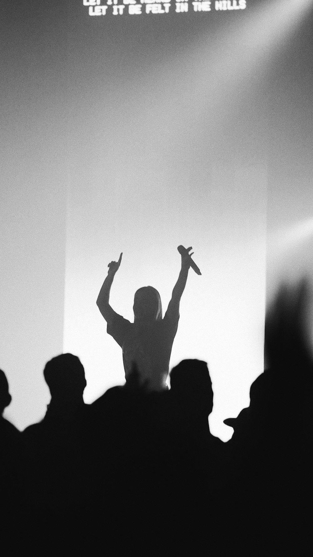 man holding microphone at the stage