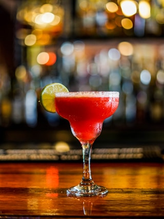 clear margarita glass on selective focus photography