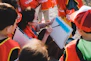 person holding dry erase board