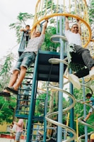 man playing on the playground slide