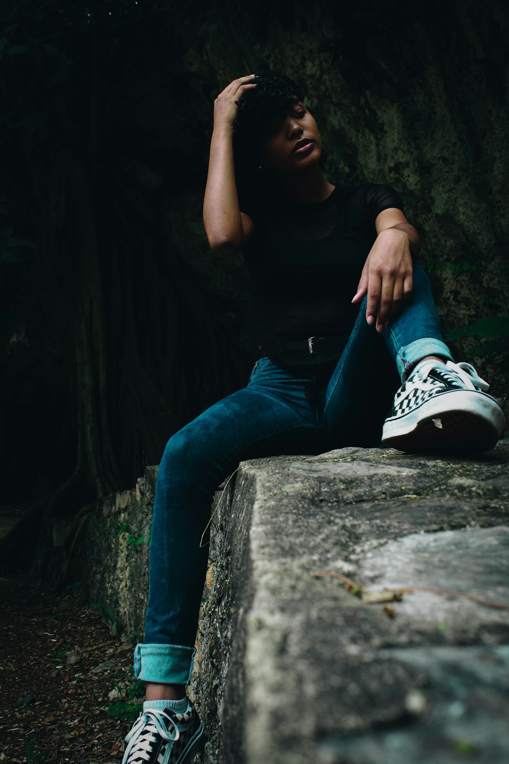 shallow focus photo of man in blue denim pants