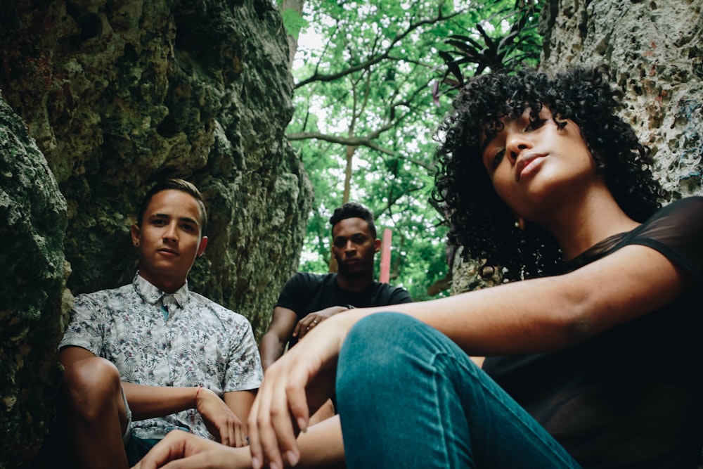 three person on rock formation