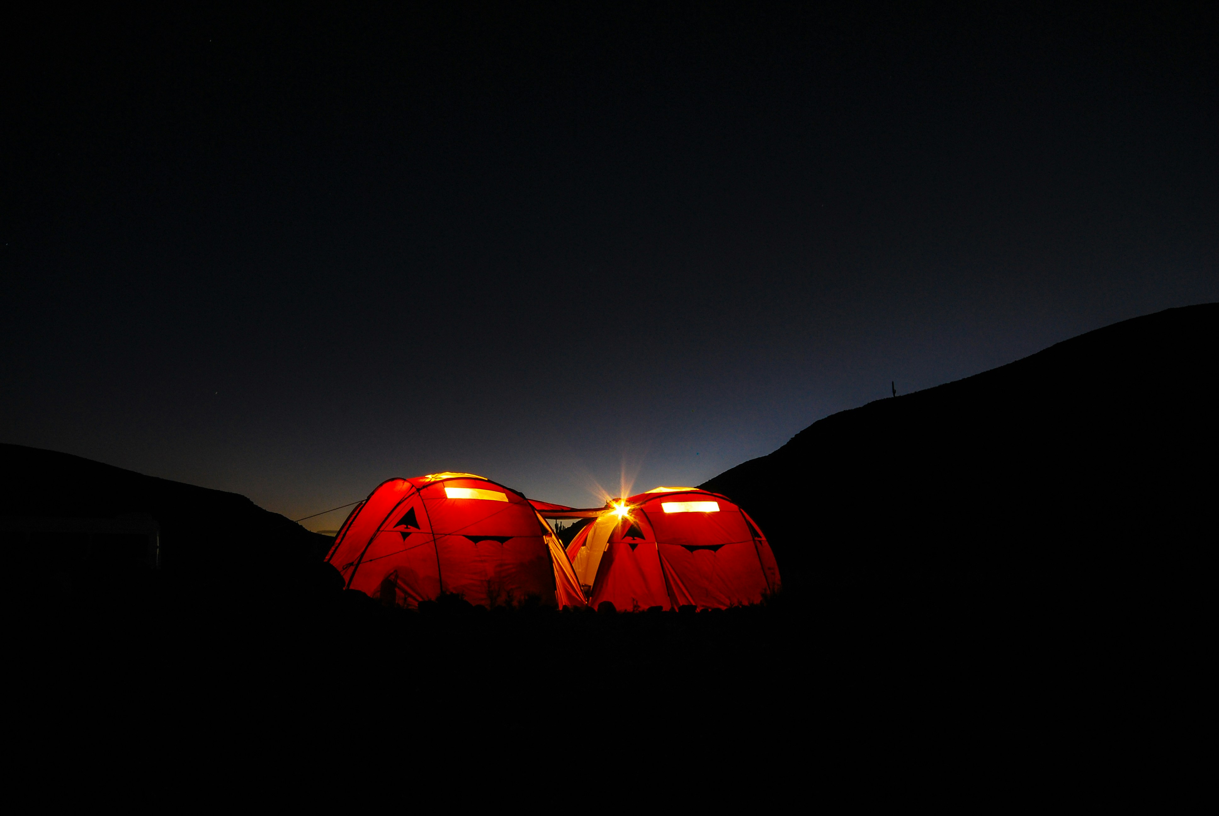 two red tents during nighttime, 