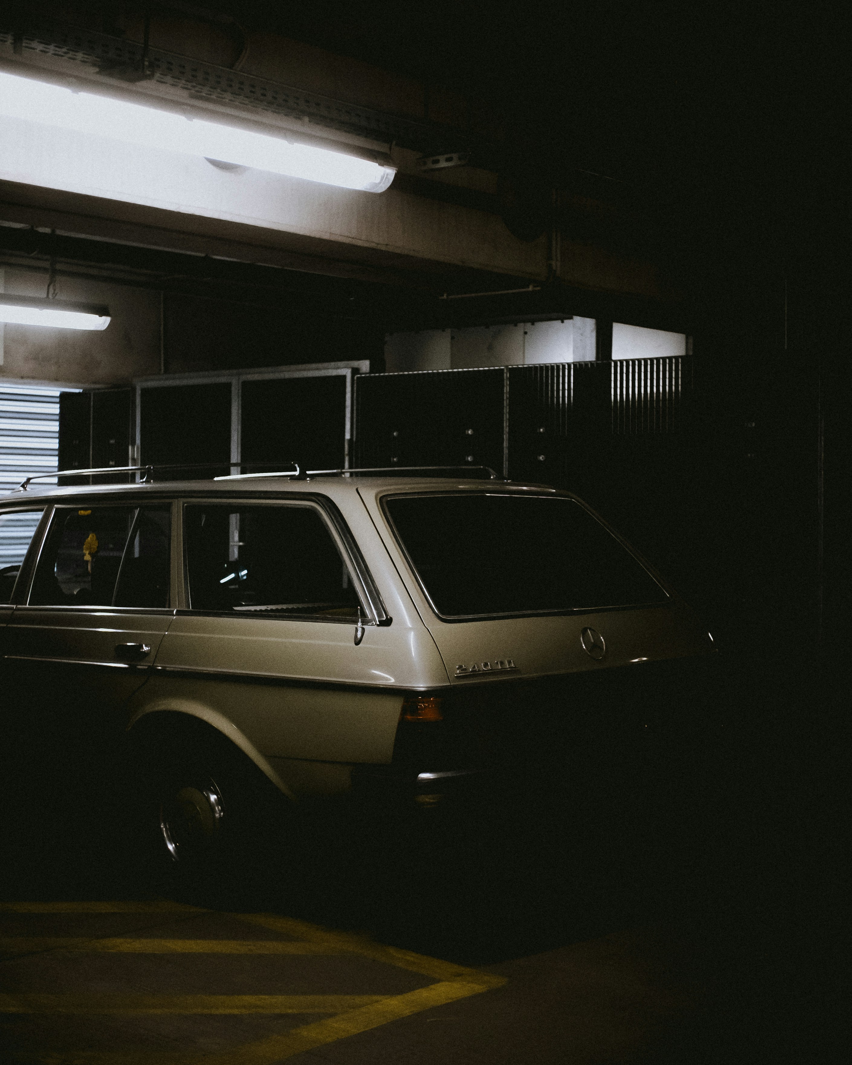 white 5-door hatchback parking inside building