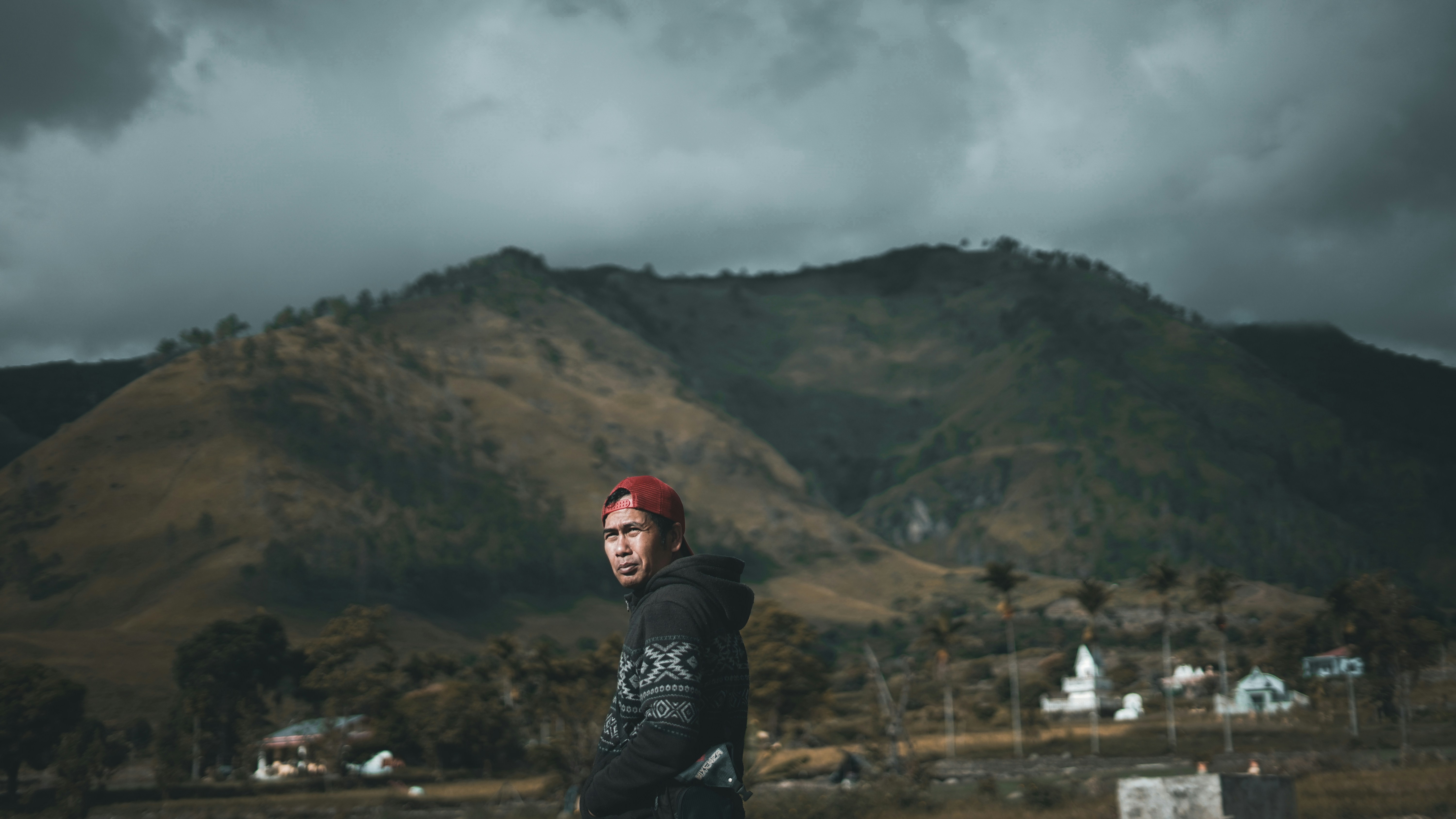 man wearing red fitted cap