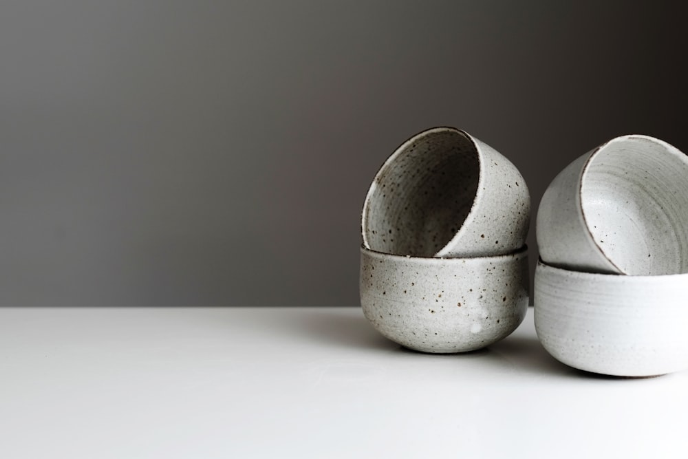 shallow focus photo of gray ceramic bowls