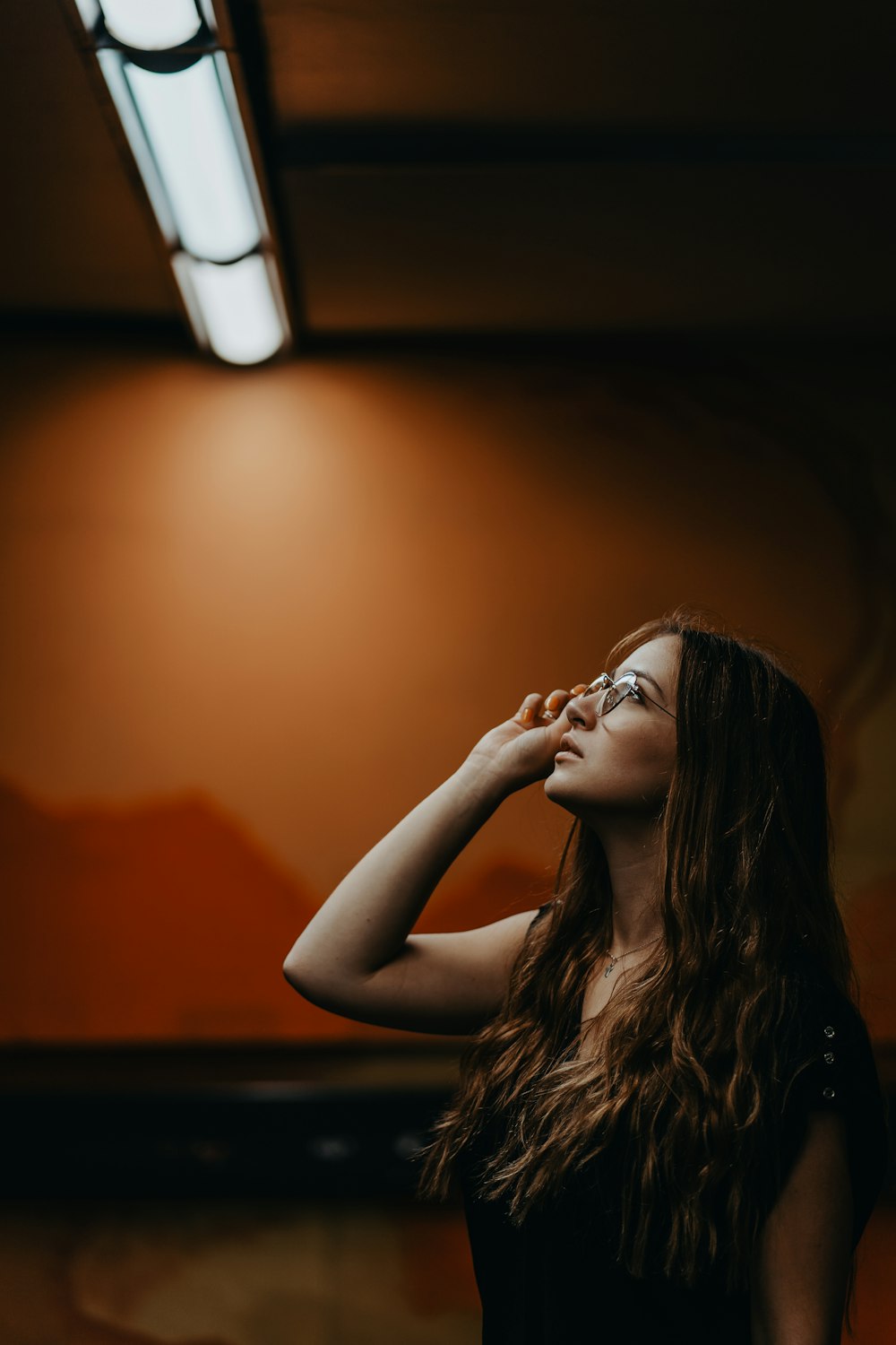 women looking at a light in a room