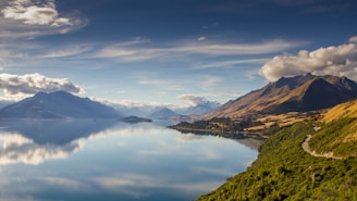 landscape photo of mountains near body of water during daytime