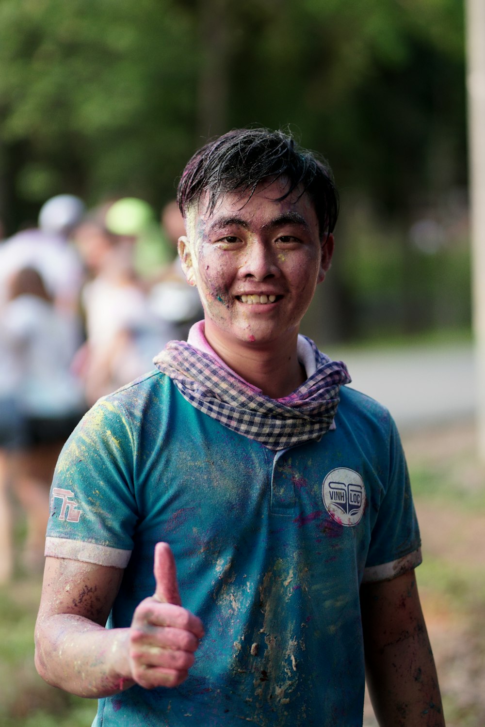 smiling man standing and making OK hand sign