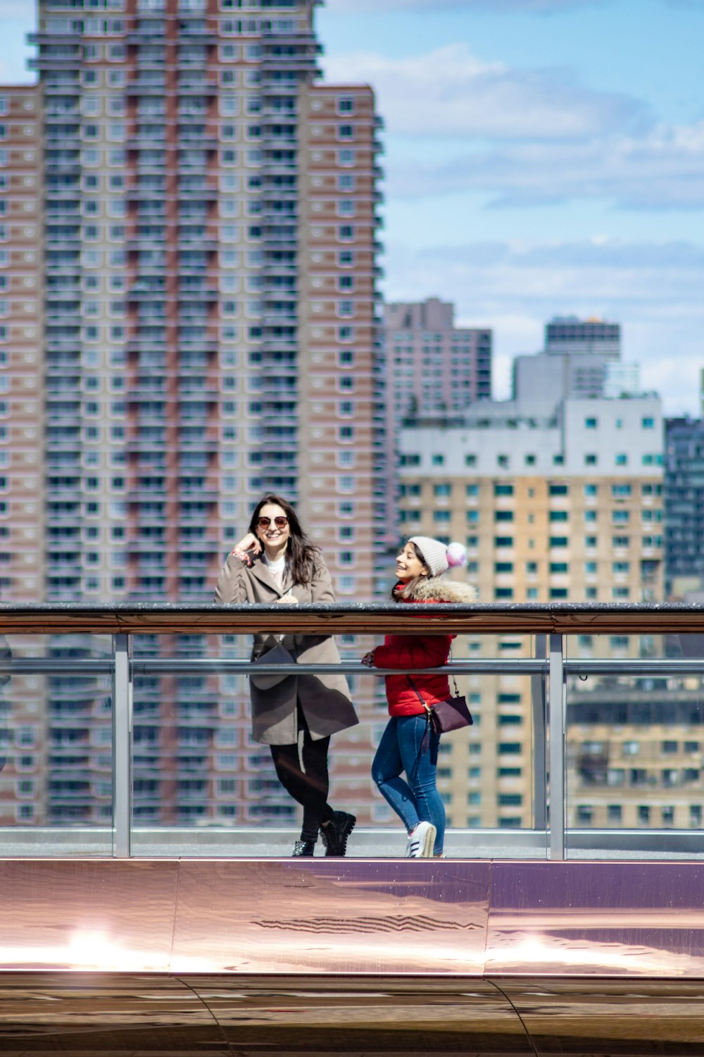 two people standing near buildings