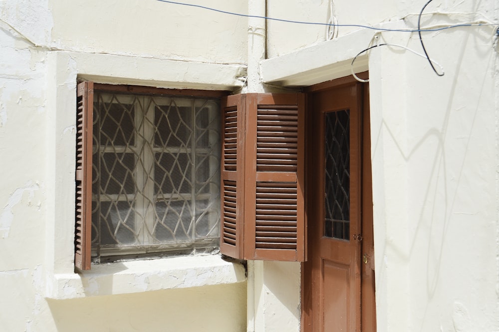 open brown wooden door and closed door