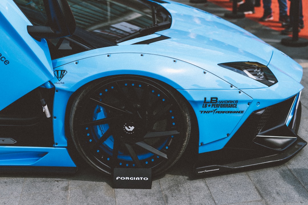 blue sports car close-up photography