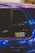 A close-up of a car window featuring a sticker with the text 'IACRO TEAM'. The car's paint appears to have an iridescent quality, reflecting various shades under the light. The window shows some reflections and blurred lights in the background.
