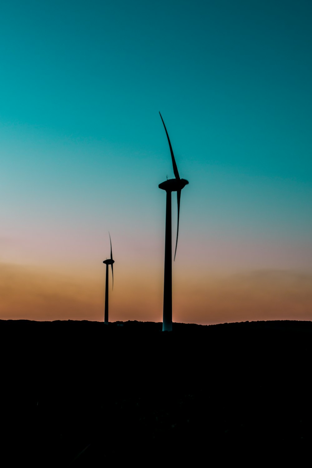 silhouette of wind turbines