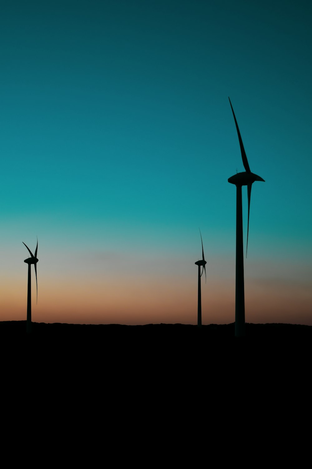 silhouette of windmills