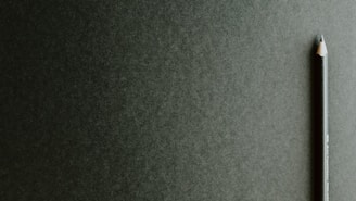 black pencil on black surface