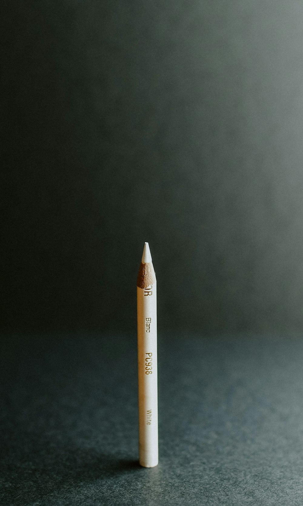 white and gray pen inside well lit room