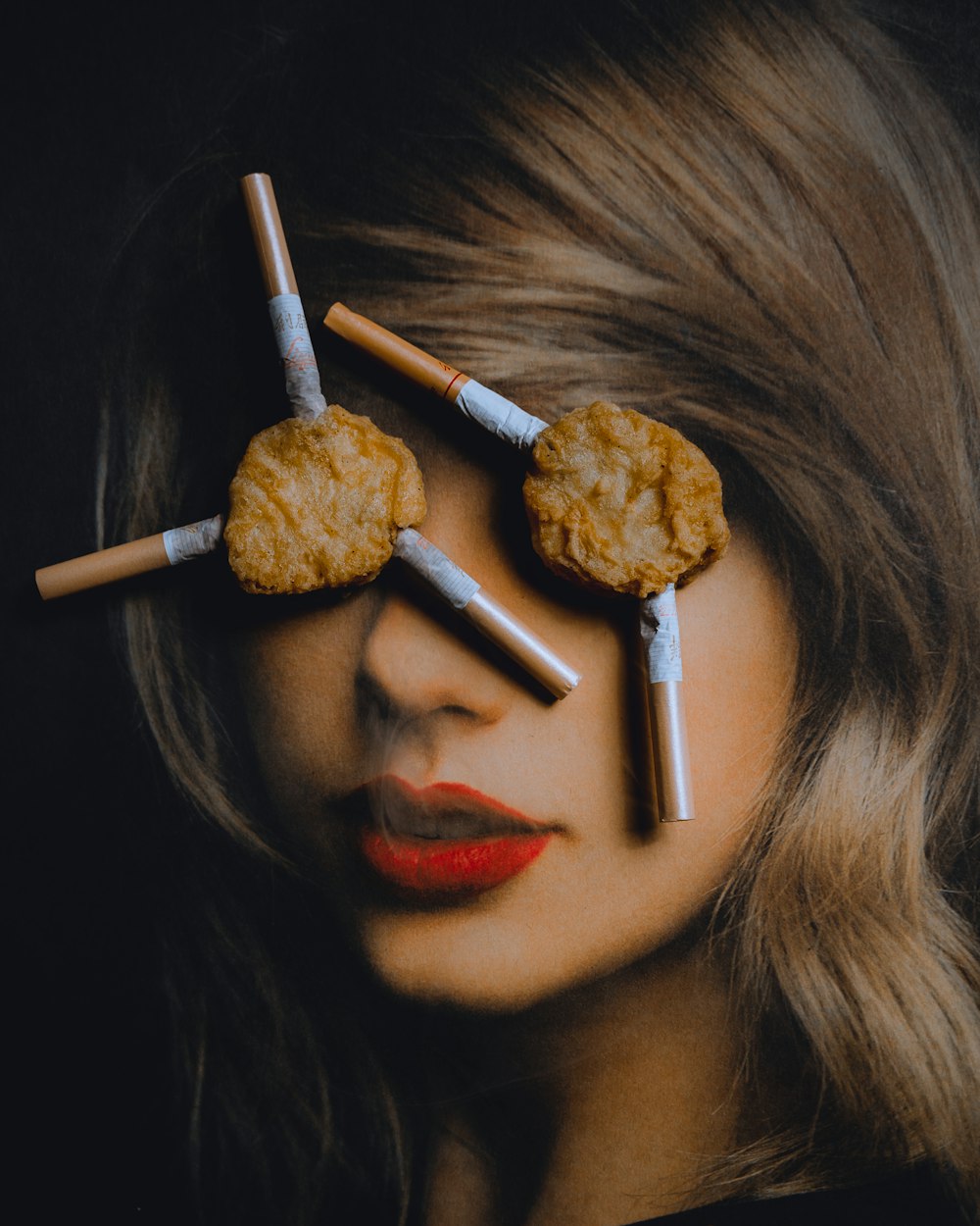 woman covering eyes with nuggets