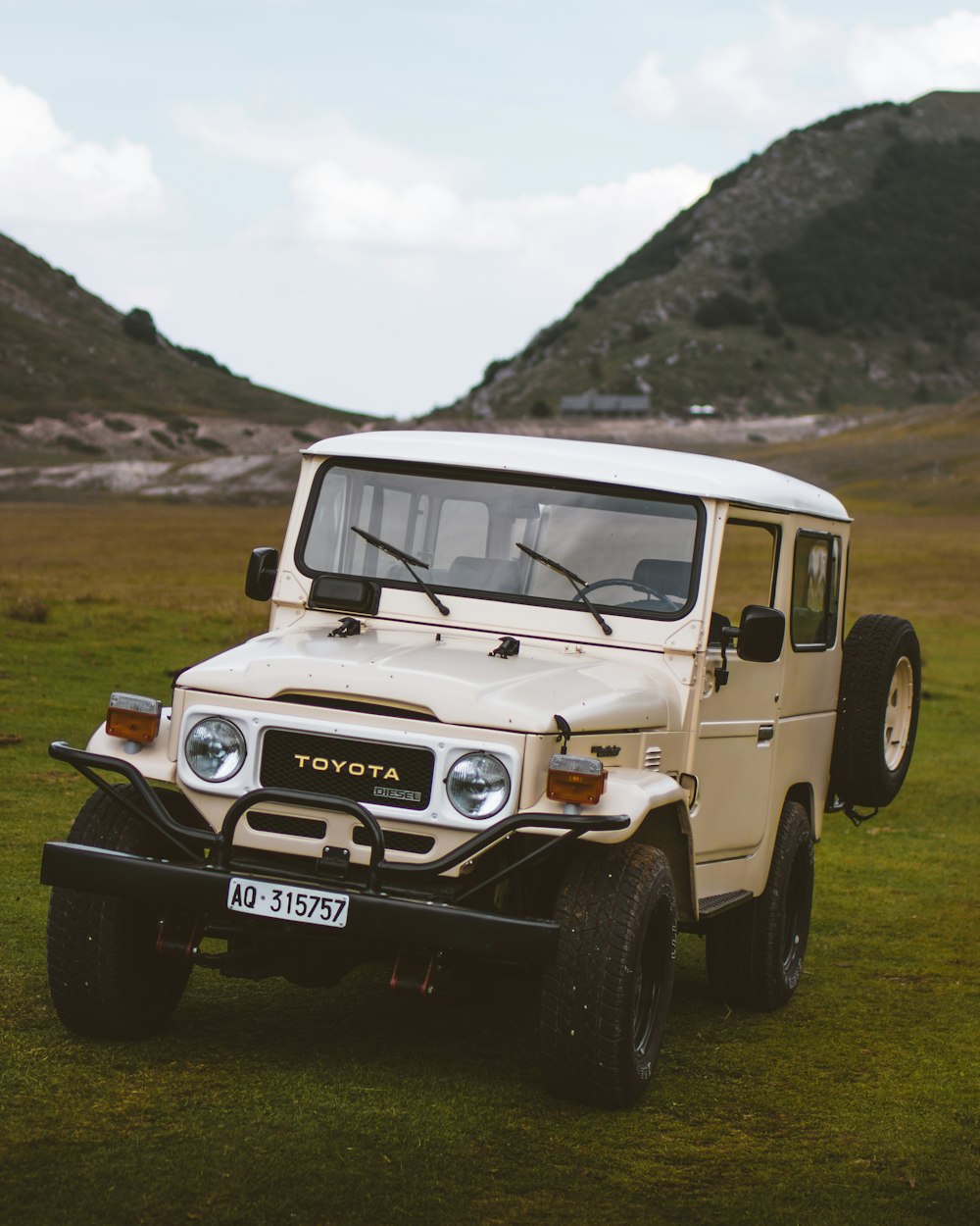 white Toyota SUV near mountain