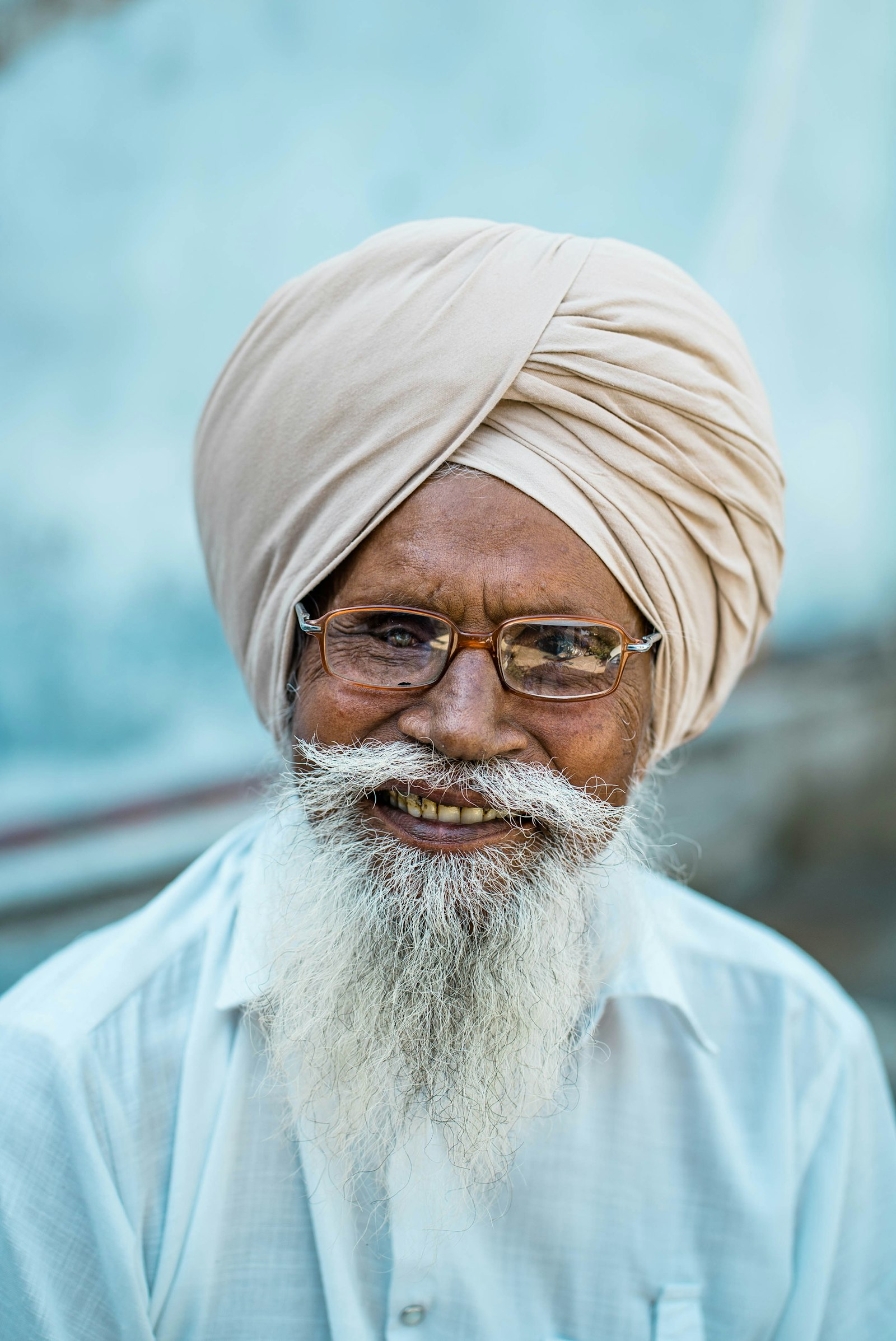 Sony a7S II sample photo. Man wearing brown framed photography