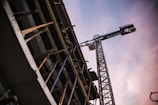 grey tower crane beside building