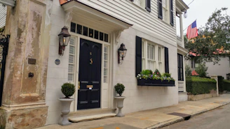 Close-up of a freshly painted door and well-maintained property exterior.